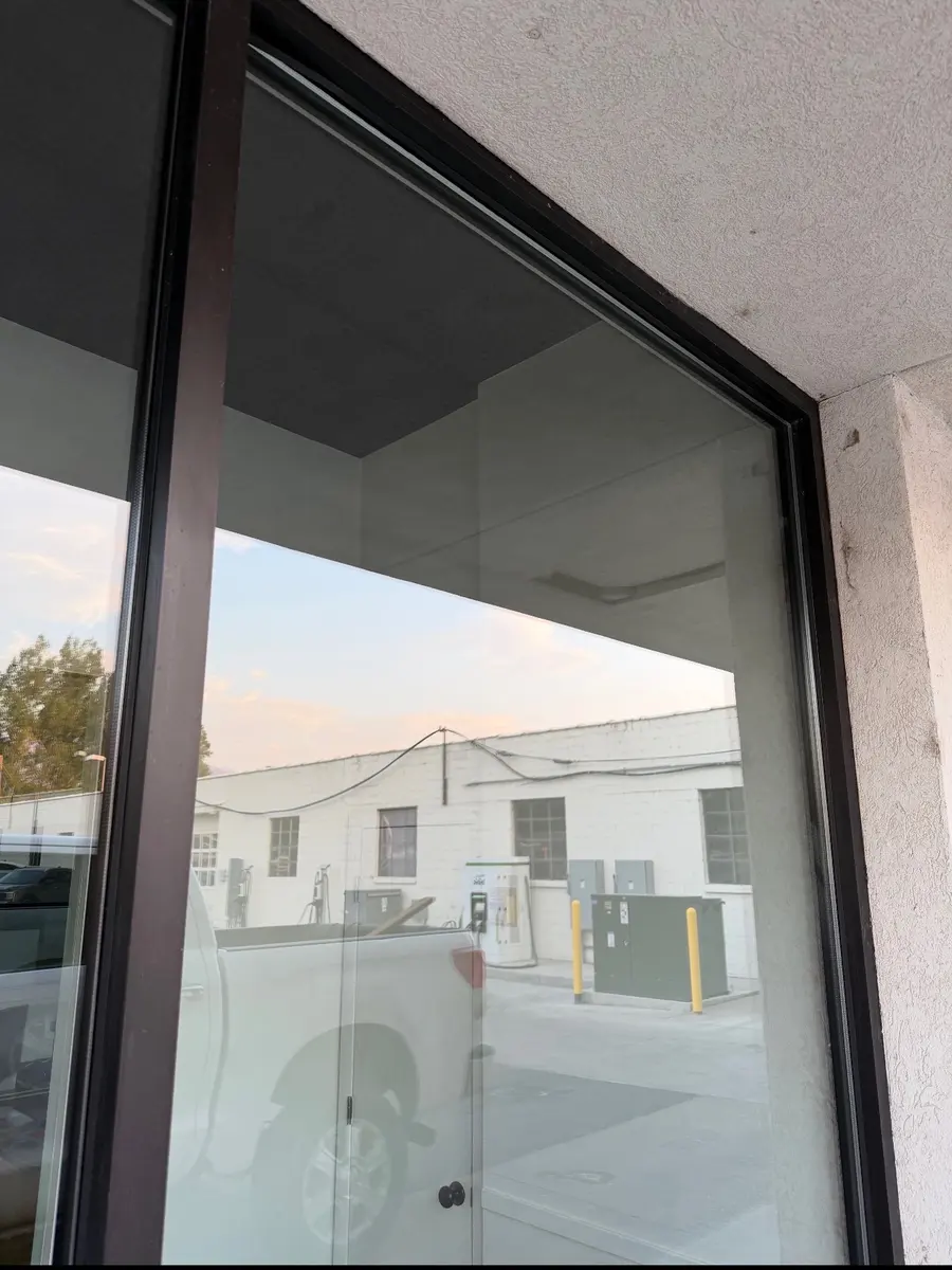 The same storefront window after Clean Grit cleaned the glass and frame