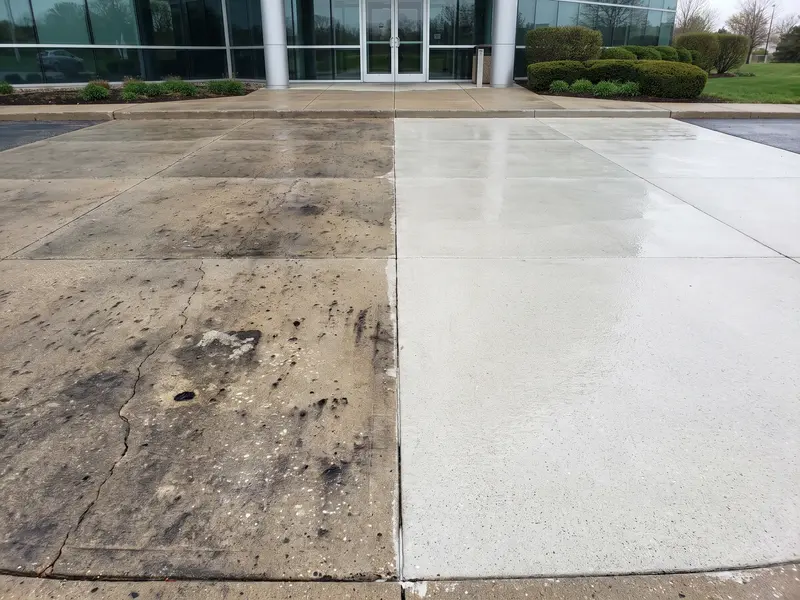 Before and after concrete pressure washing at a commercial property in Logan, UT